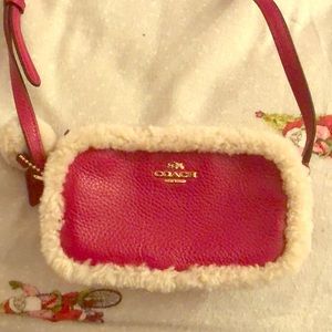 Hot pink small coach side purse with white fluff